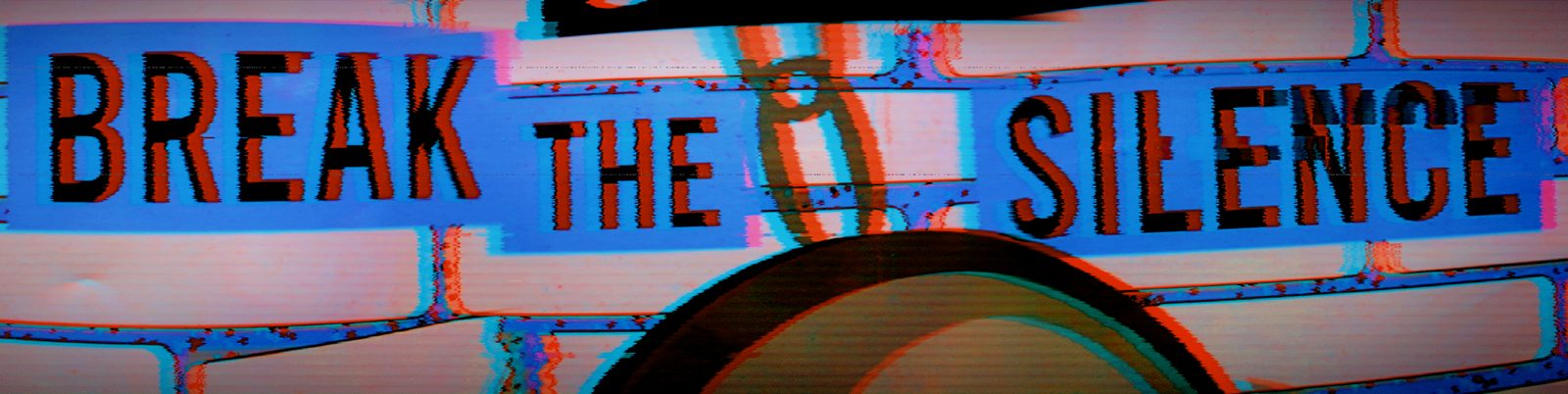 Break the Silence — Lancaster County. A banner in motion. The words survive the smear. Photographed like a passing truck, not a poster.