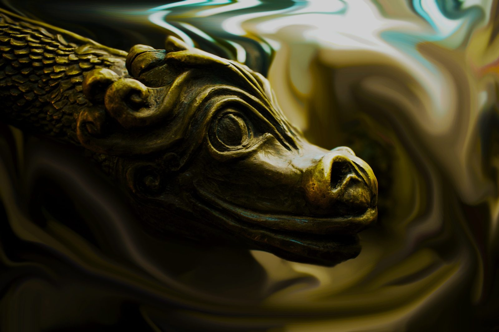 Bronze — Lancaster County. A bronze dragon head, close. Patina, a wet swirl behind it. Sculpture, not a monster — metal that got to keep a face.