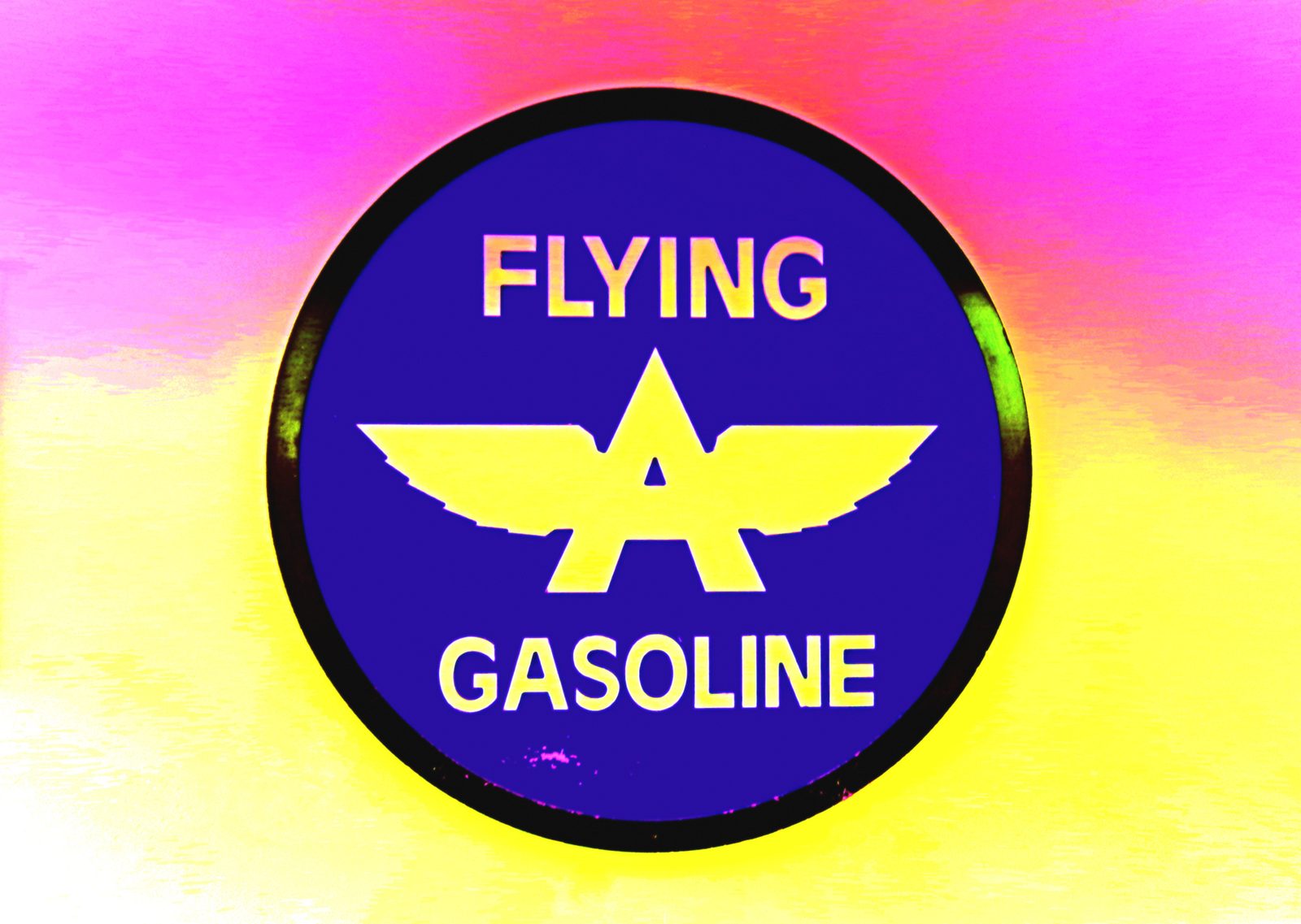 Flying A — Lancaster County. Vintage gasoline badge, yellow wings on cobalt, a pink-and-gold field behind it. Americana, held close.