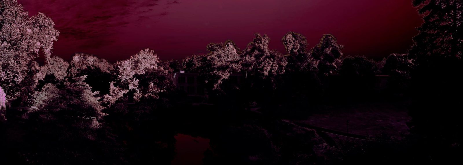 The House Across the Water — Lancaster County. An estate across a pond, trees in blossom, a crimson dusk. Panoramic, quiet, a little too still.