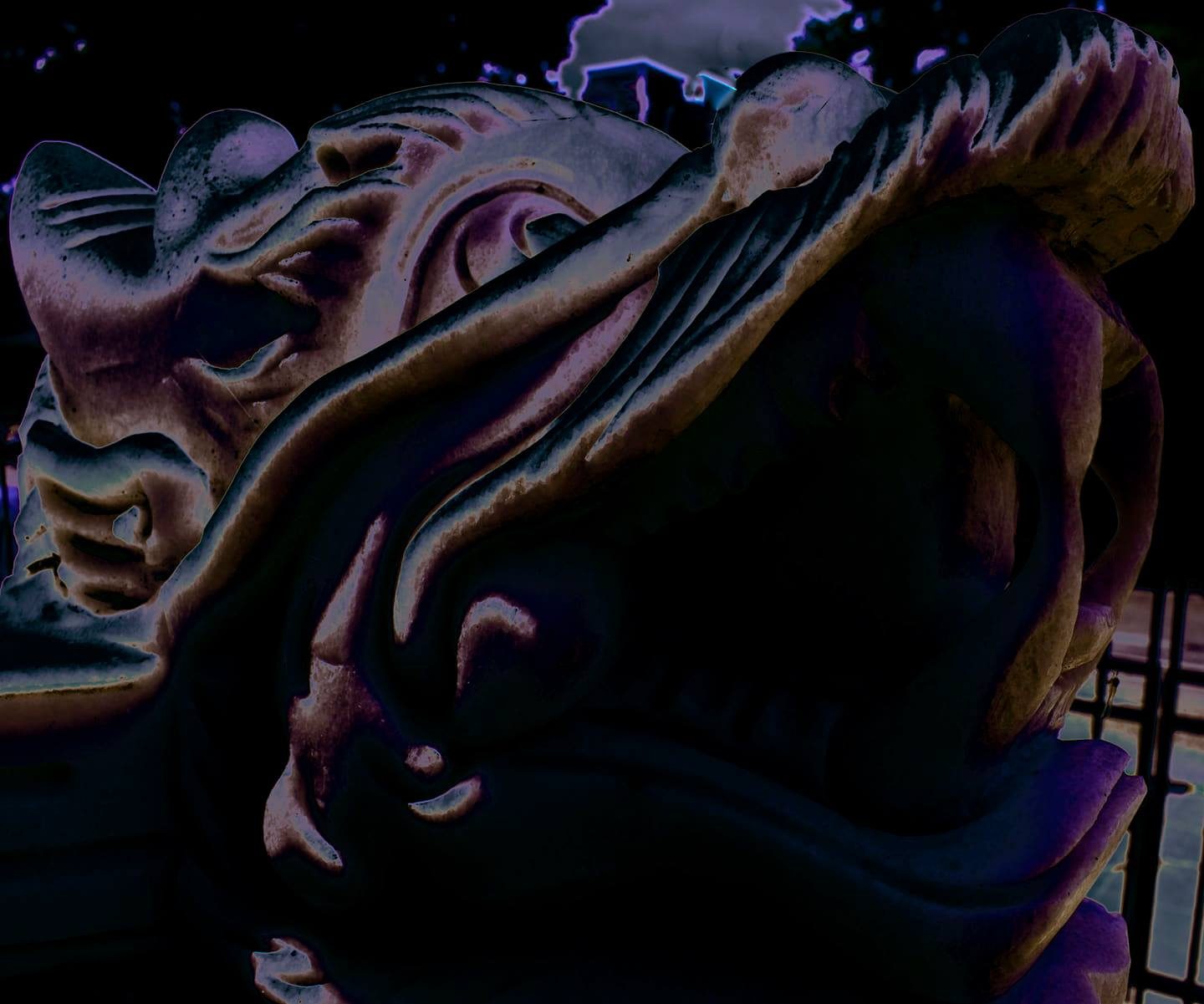 Stone Breath — Lancaster County. Another carved mouth, this one in relief. Night, purple grade. Ornament that still looks like it could bite.