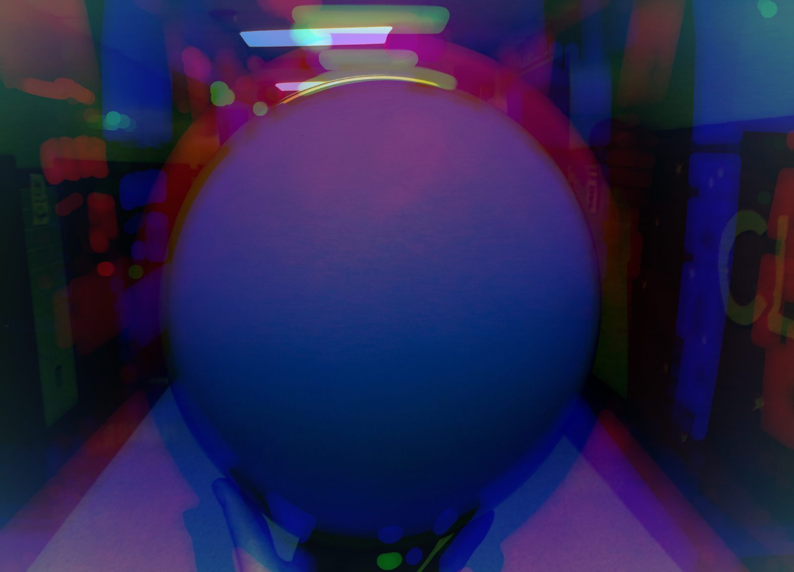 The Sphere — Studio. A glass globe in a hallway of lights. Bokeh around it, a world with no map. Held, not found.